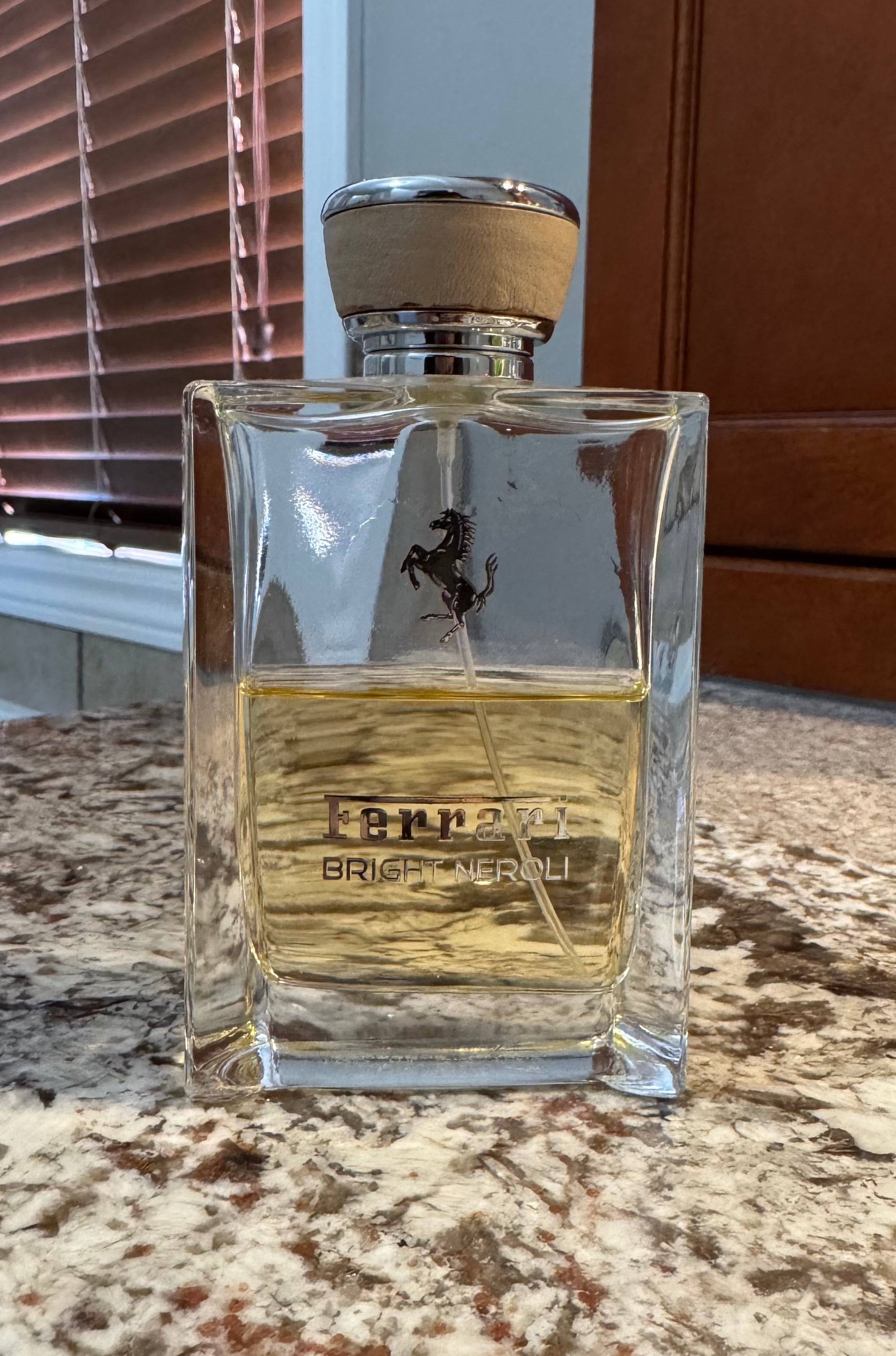 Ferrari Bright Neroli authentic fragrance, hand-decanted into a travel bottle
