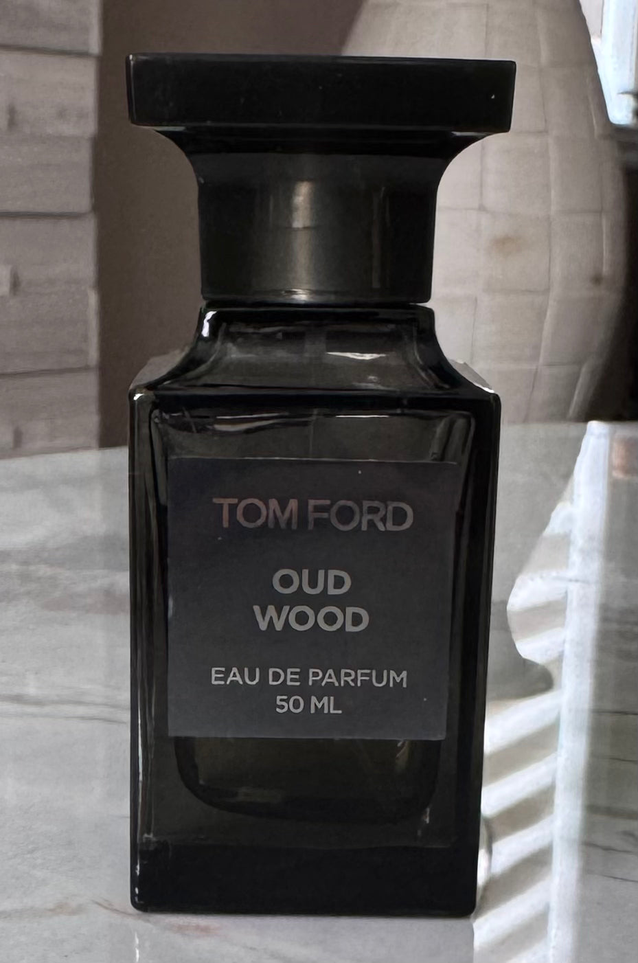 Tom Ford Oud Wood EDP authentic fragrance, hand-decanted into a travel bottle