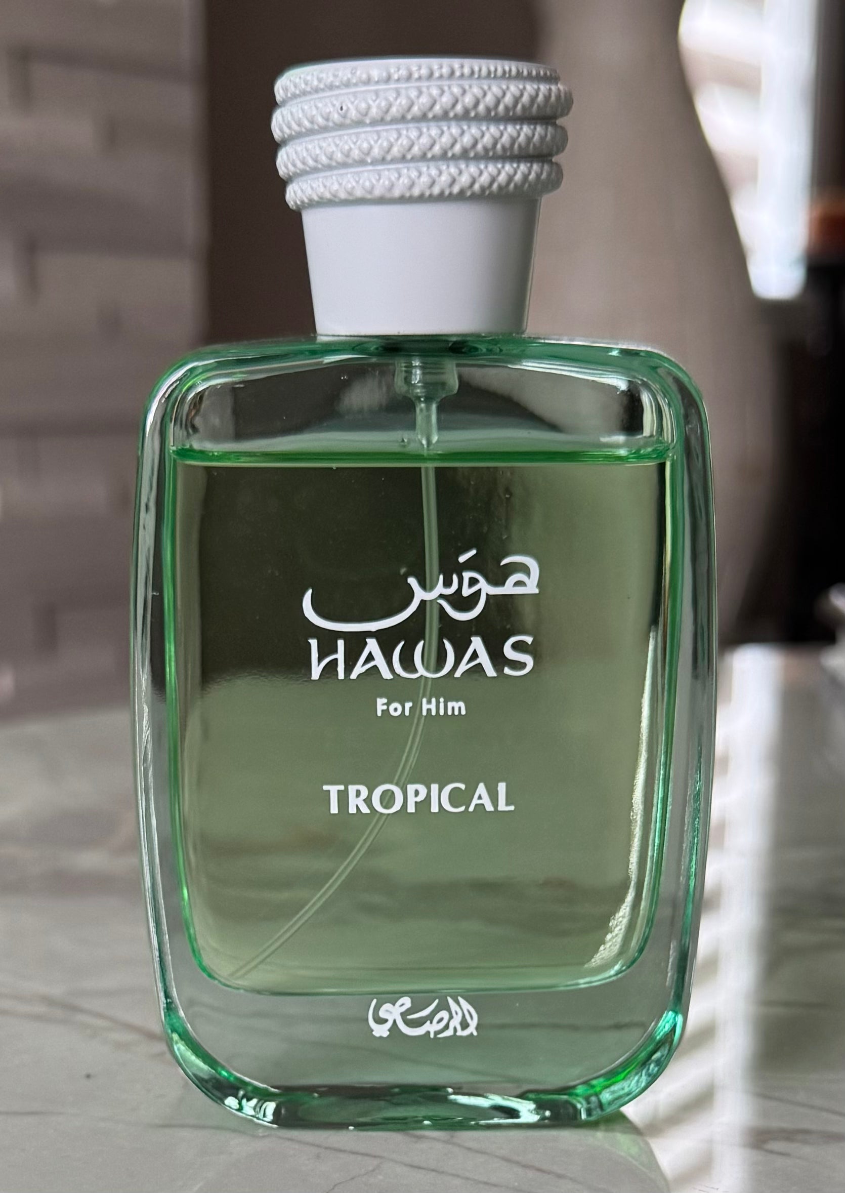 Rasasi Hawas Tropical authentic fragrance, hand-decanted into a travel bottle