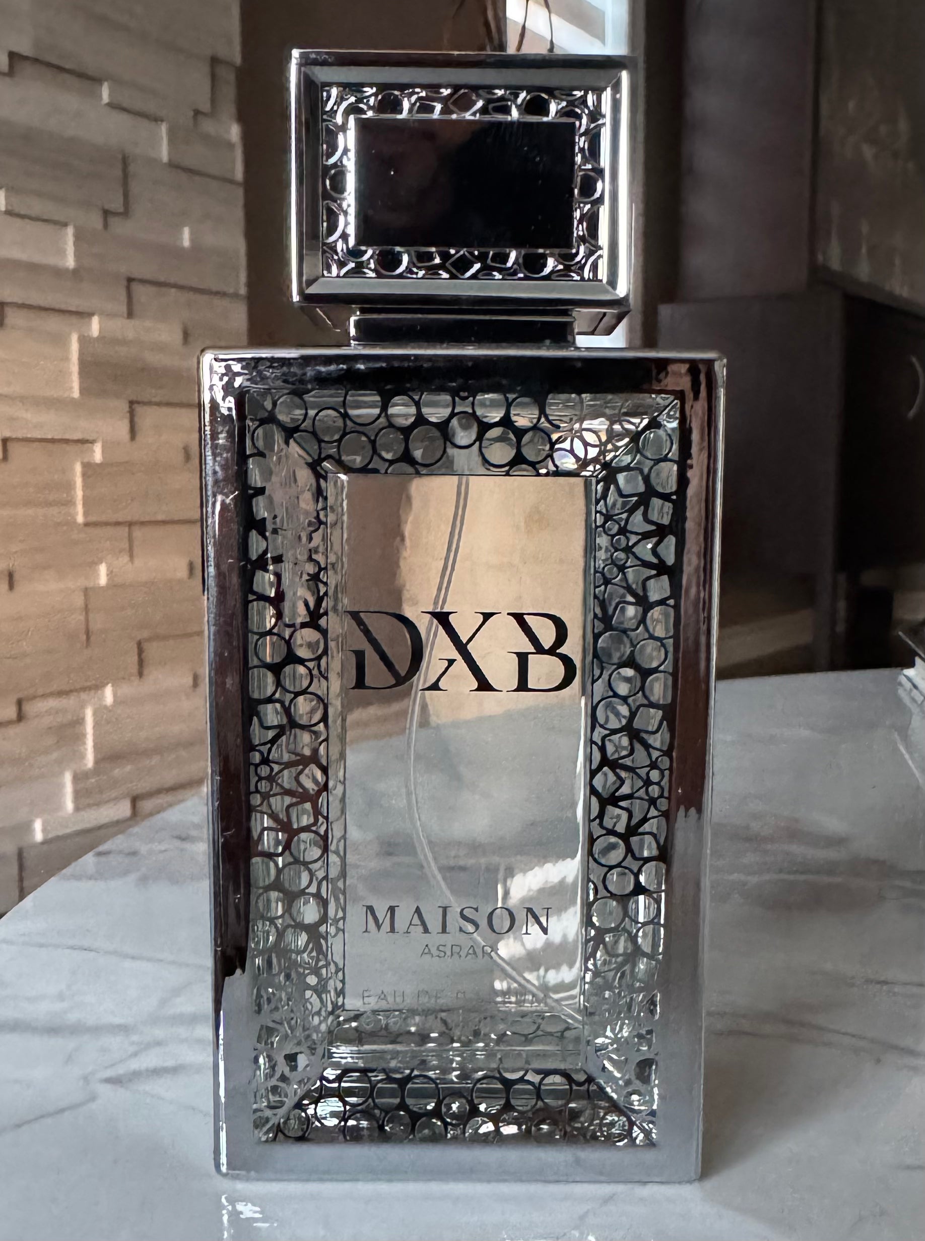 Maison Asrar DXB authentic fragrance, hand-decanted into a travel bottle by Maison Sillage Co.