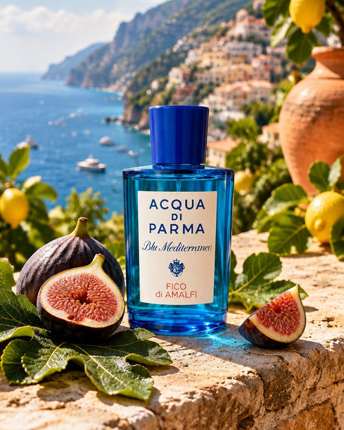 Acqua di Parma Fico di Amalfi bottle with fresh figs on a stone wall above the Amalfi coast