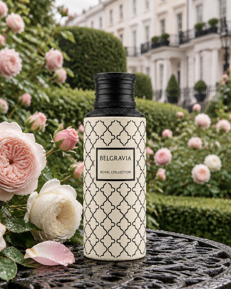 Maison Asrar Belgravia bottle among pink roses in front of white London townhouses